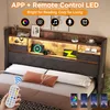 A bed with a headboard featuring integrated LED lighting and storage compartments, shown in a bedroom setting. Produktbild-Vorschau