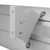 A close-up view of a metal bracket attached to a ribbed surface. Náhled obrázku produktu