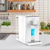 A white water filter sits on a kitchen counter next to a sink and some potted plants. Produktbild-Vorschau