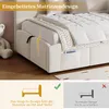 A close-up view of a beige upholstered bed frame with a mattress partially inserted, highlighting a snap-in design feature. The lower part of the image contains a comparison graphic illustrating the product's feature versus a standard design. Anteprima dell’immagine prodotto