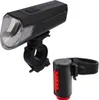 A black bicycle front light and a red bicycle rear light are shown against a white background. Anteprima dell’immagine prodotto