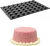 A silicone mold for mini muffins and a decorated mini cake. Produktbild-Vorschau