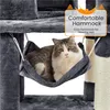 A cat is resting in a hammock attached to a multi-level cat tree. The cat tree has scratching posts and platforms. Podgląd zdjęcia produktu