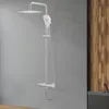 A shower system is mounted on a gray wall, with a wooden accent wall and a dark bathtub in the background. Produktbild-Vorschau