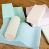 A collection of soft play blocks in pastel colors arranged on a wooden floor. Produktbild-Vorschau