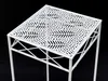 A white metal plant stand with a decorative perforated top sits on a black background. Anteprima dell’immagine prodotto
