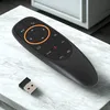 A black remote control and a USB dongle are placed on a marble surface. Produktbild-Vorschau
