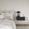 A bedroom scene with a bed and a nightstand. Voir les images du produit
