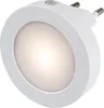 A white, round LED night light with a plug. Voir les images du produit