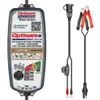 A battery charger and its accessories are displayed against a white background. Voir les images du produit