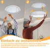 Two men are shown installing a ceiling light fixture. Produktbild-Vorschau
