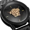 Close-up of a black Versace watch with a gold Medusa head emblem. Náhled obrázku produktu