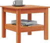 A wooden side table with a cup and saucer on top and magazines on the shelf below. Náhled obrázku produktu