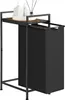 A black laundry hamper with a wooden shelf and white bottles on top, set against a white background. Produktbild-Vorschau