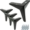 A set of four black metal furniture legs and screws on a white background. Produktbild-Vorschau