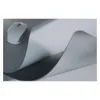 A white computer mouse rests on a gray surface next to a large, gray mousepad that is partially lifted, revealing its textured underside. Anteprima dell’immagine prodotto