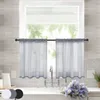 A kitchen sink area with a window covered by two grey sheer curtains. Produktbild-Vorschau