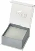 An open jewelry box with the brand logo visible on the inside of the lid. Voir les images du produit