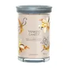 A Yankee Candle jar with a lid, featuring vanilla creme brulee scent. Voir les images du produit