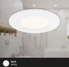 A white LED recessed light fixture is shown against a blurred background of a bathroom. Produktbild-Vorschau