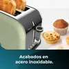 A close-up of a green toaster with toast inside, next to some pastries. The bottom of the image has a teal overlay with text. Anteprima dell’immagine prodotto