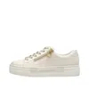 A side view of a beige sneaker with a platform sole and a gold zipper. Náhled obrázku produktu