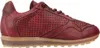 A side view of a red leather sneaker with perforations and a tan sole. Voir les images du produit