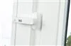 A close-up of a white door lock mechanism. Produktbild-Vorschau