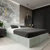 A bedroom with a bed, nightstand, and wardrobe. Produktbild-Vorschau