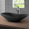 A black ceramic vessel sink with a chrome faucet is shown on a wooden countertop in a bathroom setting. Náhľad obrázku produktu