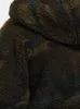 A close-up view of a fuzzy, camouflage-patterned jacket. Produktbild-Vorschau