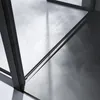 A close-up view of a shower enclosure's corner and floor, highlighting its sleek design and reflective surfaces. Produktbild-Vorschau