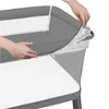 Hands are shown adjusting a cover on a baby crib or bassinet. Anteprima dell’immagine prodotto