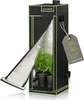 A black and green indoor grow tent with the front flap open, revealing two potted plants inside. A tag with product dimensions is attached to the side. Náhled obrázku produktu