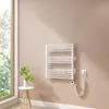 A white electric towel warmer mounted on a light pink wall next to a window. Produktbild-Vorschau