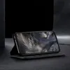 A black flip-style phone case is shown open, with a smartphone inside displaying a wallpaper. The case is propped up in a stand position on a dark surface, with a dark background. Produktbild-Vorschau