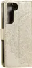A close-up, angled view of a gold-colored flip phone case with an embossed mandala pattern. Produktbild-Vorschau
