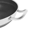 A close-up view of the handle and interior of a stainless steel pan. Náhled obrázku produktu