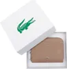 A taupe Lacoste coin wallet is presented inside its white branded box. Voir les images du produit