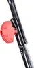 A close-up of a red knob attached to a black metal pole. Produktbild-Vorschau
