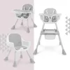 A collage of a baby high chair in different configurations and angles, presented on a split background of pink and white with geometric patterns. Podgląd zdjęcia produktu