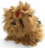 A stuffed toy Yorkshire Terrier with a red bow on its head, set against a white background. Náhled obrázku produktu