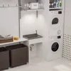 A laundry room with a sink, washing machine, and dryer. Podgląd zdjęcia produktu