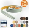A roll of flexible, self-adhesive PVC skirting board with a light green color, shown partially unrolled, alongside a selection of color swatches. Anteprima dell’immagine prodotto