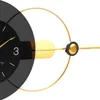 A close-up of a modern wall clock with a black face and gold accents. Anteprima dell’immagine prodotto