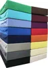 A stack of folded fitted sheets in various colors. Produktbild-Vorschau