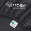 A close-up of a dark gray fitted sheet, showing the elasticized edge and a product label. Produktbild-Vorschau