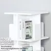 A white, multi-tiered rotating bookshelf with books and decorative items on display. Podgląd zdjęcia produktu