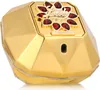 A close-up, studio shot of a gold-colored perfume bottle with red jewel accents. Voir les images du produit