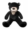 A large black teddy bear is sitting on a white background. Podgląd zdjęcia produktu